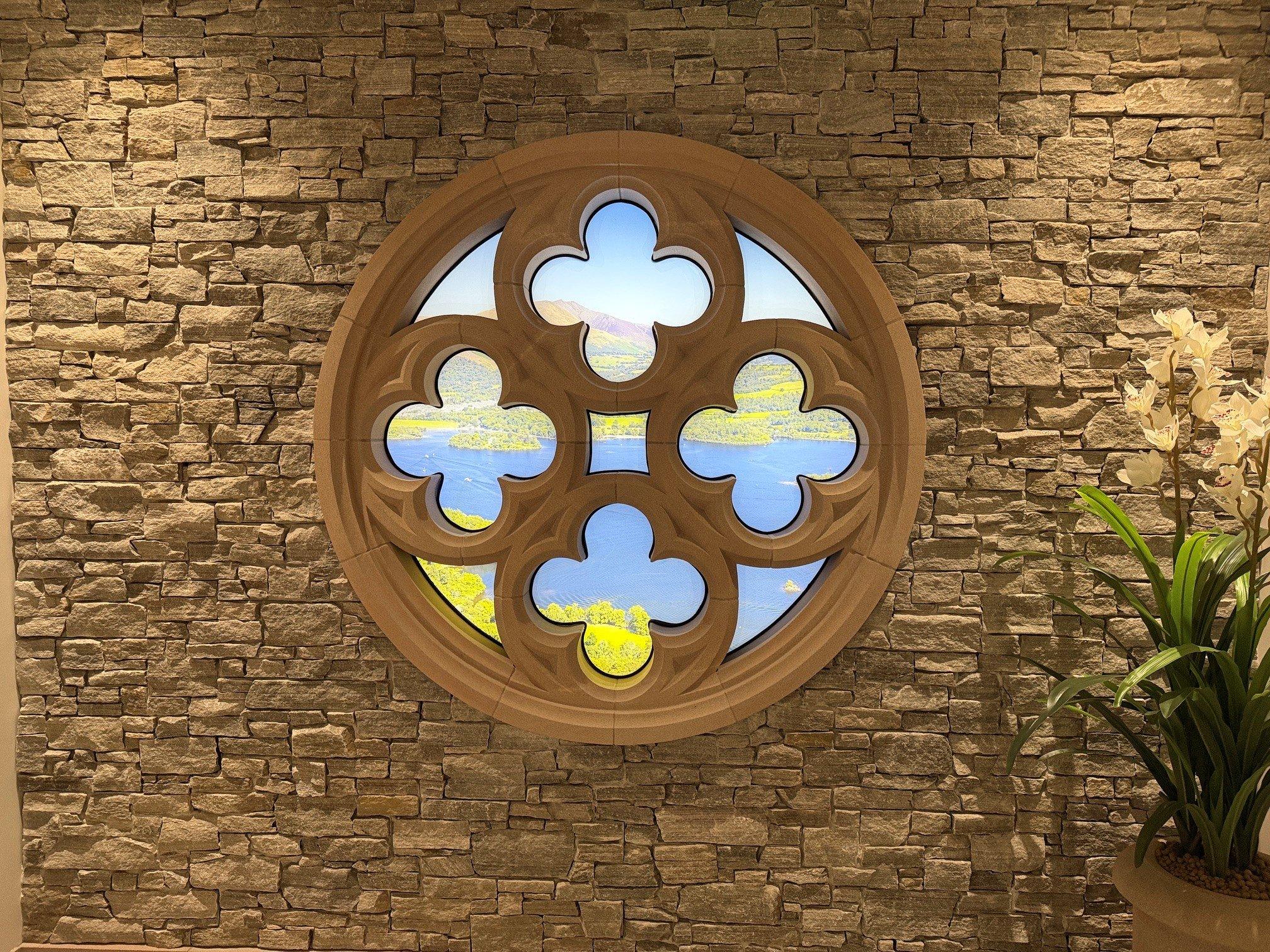 Derwent View Wattscliffe sandstone rose window with the CS Plus+CLad system, looking out over lake Derwent in the Cumbrian Stone Showroom