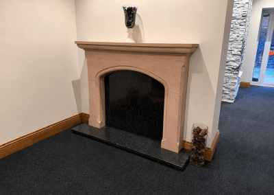 The Ellipse fire surround in Lazonby sandstone