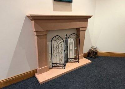 The Wave Fire Surround in Lazonby Sandstone